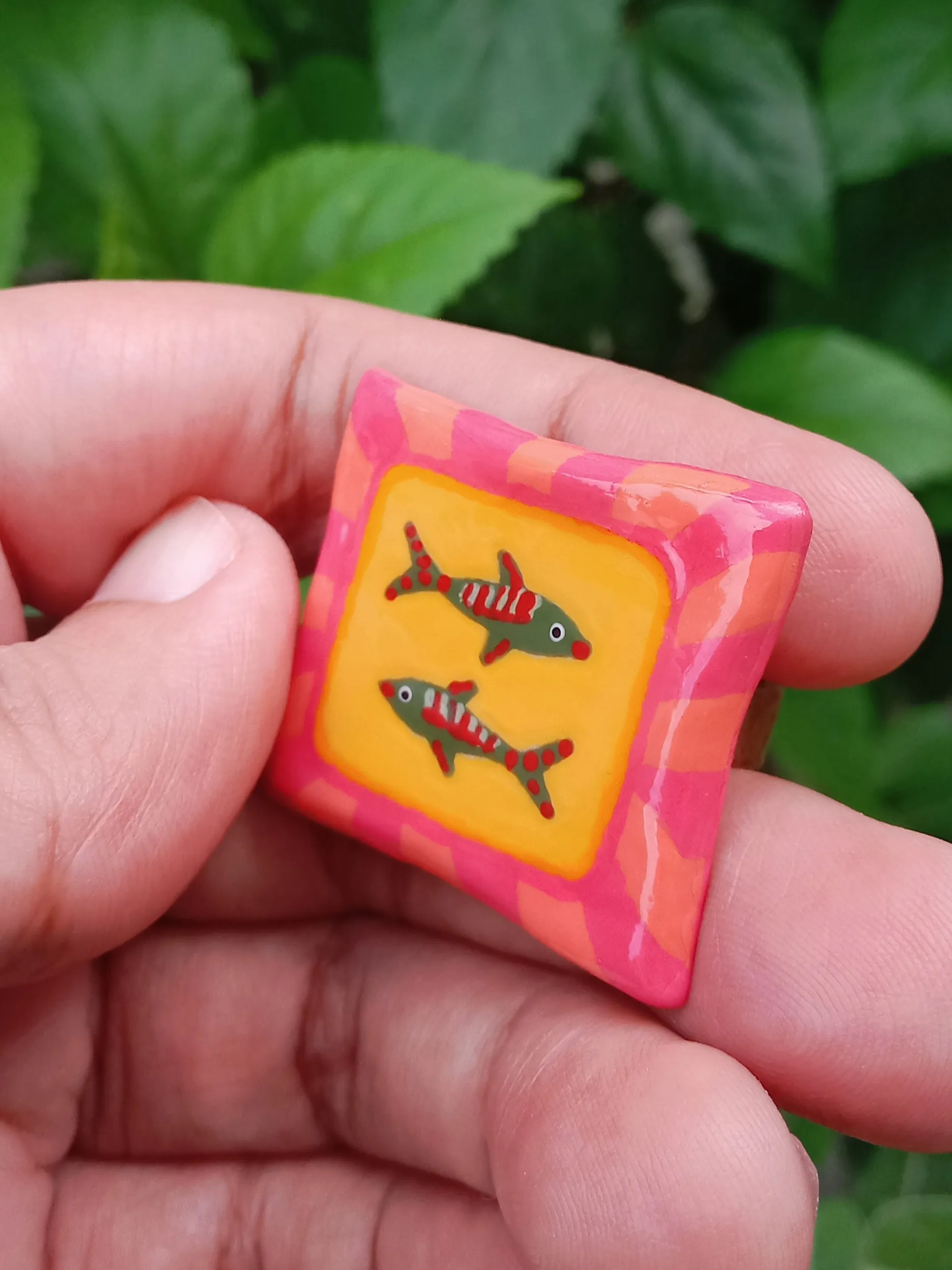 Side view of the Studio Gayatri 16mm rectangular fish Hand-painted clay ring